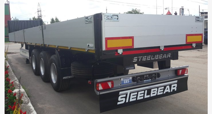 Полуприцеп бортовой STEELBEAR PT-24B — задний боковой вид